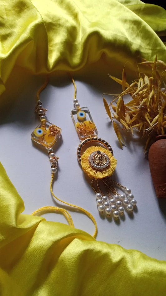 Yellow Color Resin Lumba Rakhi For Bhaiya And Bhabhi - Premium Rakhi from TheGiftBays - Just ₹400! Shop now at TheGiftBays